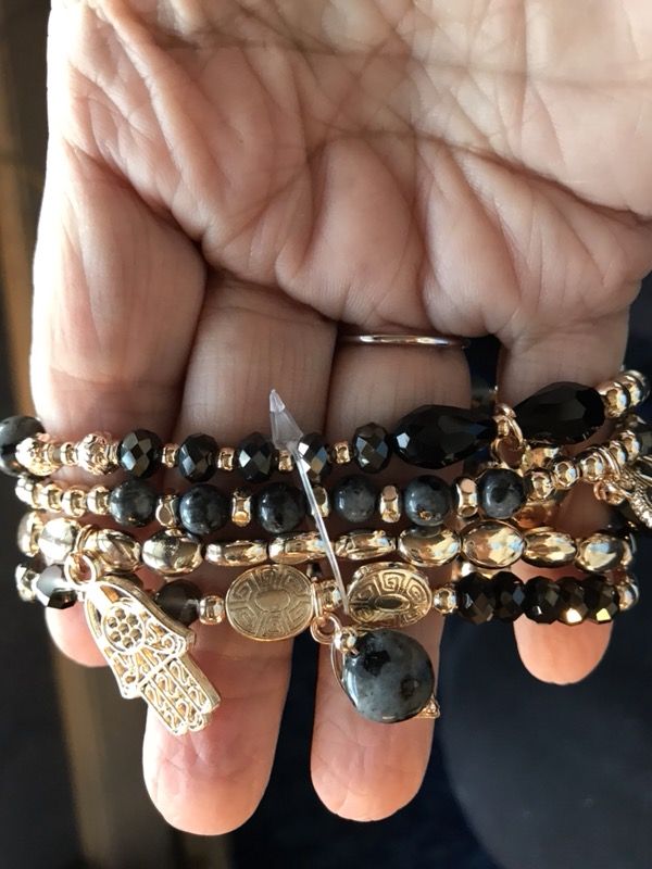 Black, gold, and grey charm stretch bracelet