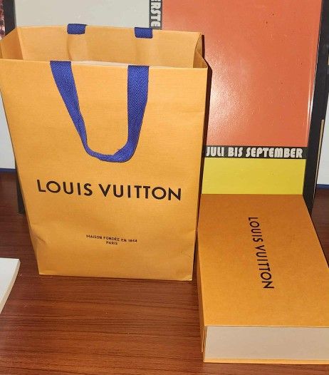 Louis Vuitton shopping bag and a Louis Vuitton gift box 7x11.