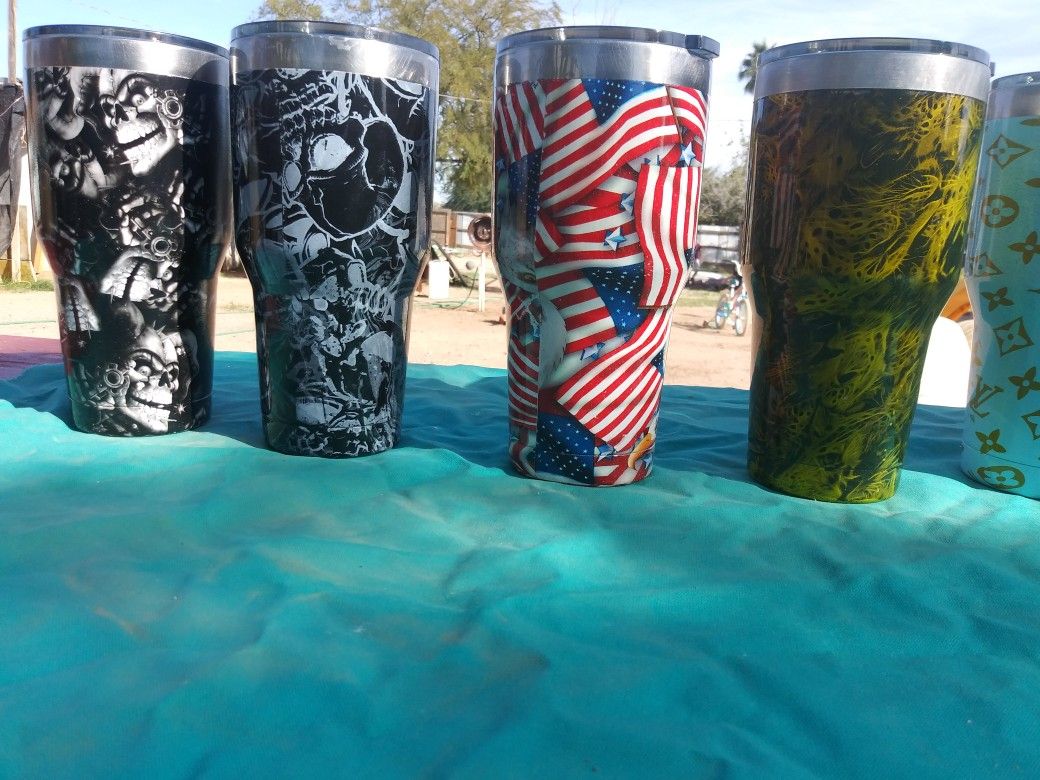 Cups for hot or cold item's Hydro dip painting on outside. Small one's hold a can for soda or beer other items can be painted as well.