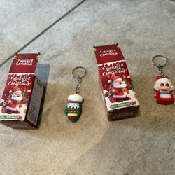 2 Merry Christmas doll pendant. Open box.