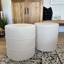 Cream colored ottomans/foot stools. 17” diameter, 18” high. 