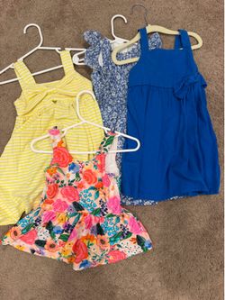 Assortment of Toddler Girl Dresses and Bathing Suit