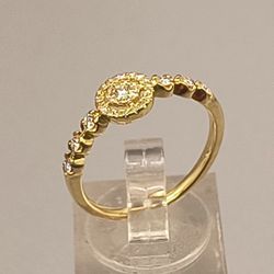 14k Rose Gold Diamond ring. 2.1g

.25ctw. Halo type center with 5 beaded diamonds on each side of the shank. F Color VS Clarity  #128