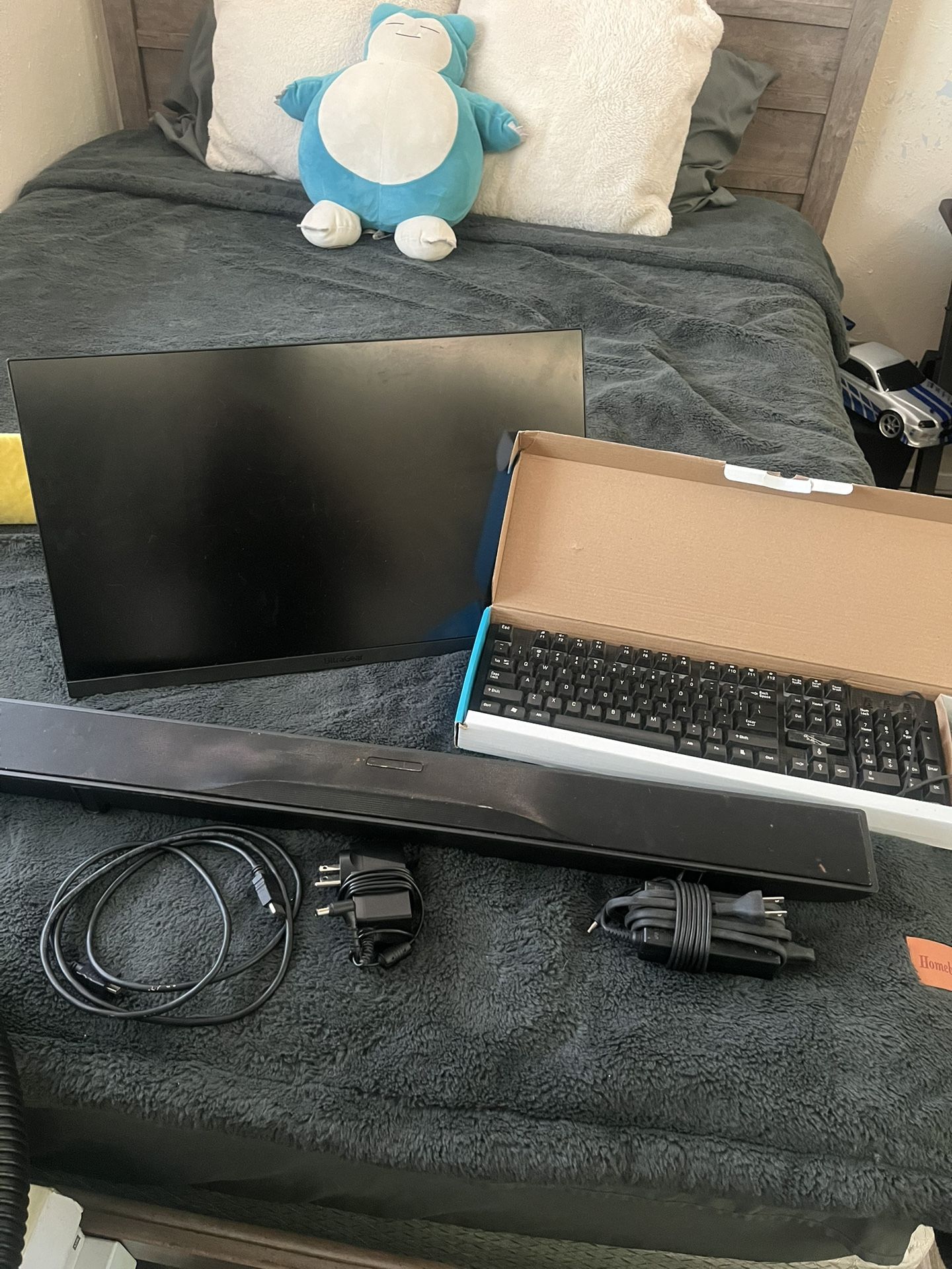 monitorkeyboard and mousethe sound bar and the stan thing