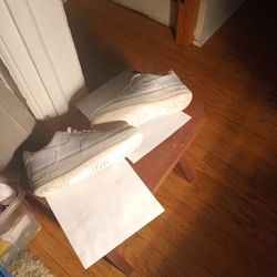 all white low tops NIKE AIR FORCE ONES  size 9 1/2