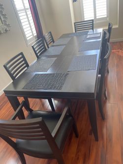 9-piece Crate&Barrel dinning table or 8 chairs (retail 4400)