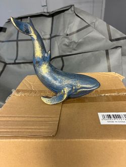 Blue and gold whale sculpture figurine
