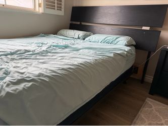 Black and silver three-piece bedroom set