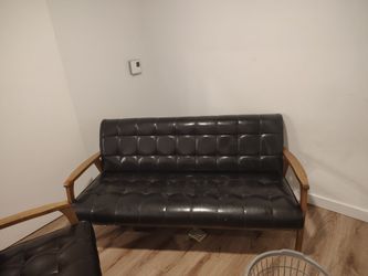 Black leather couch and love seat