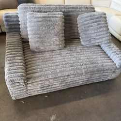 Plush gray sofa set comes with an ottoman. Message for pricing. Located in Ceres; delivery available
