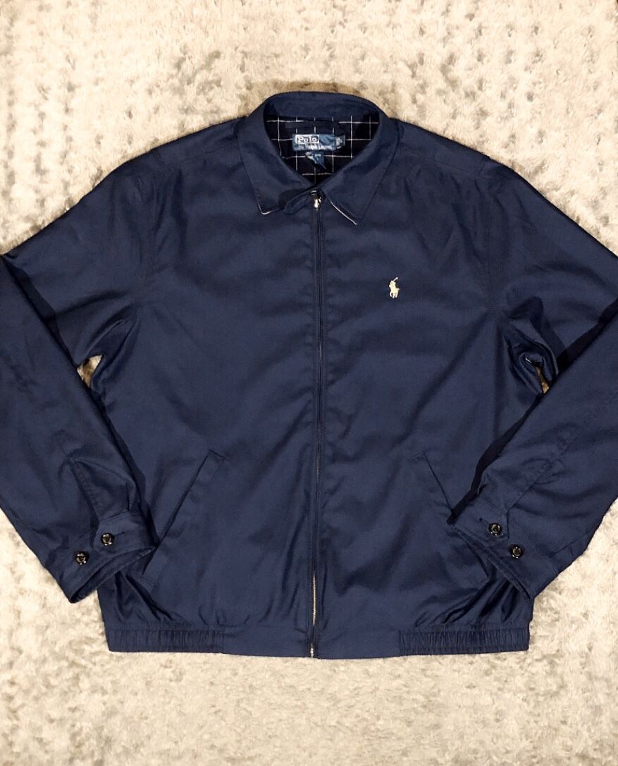 Men’s Polo Bi-Swing Windbreaker paid $155 Size L Like New Condition no signs of wear. Navy blue with cream polo logo. Great jacket
