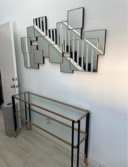 Uttermost mirror and credenza