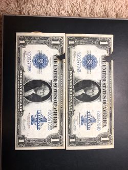 Two consecutive 1923 $1