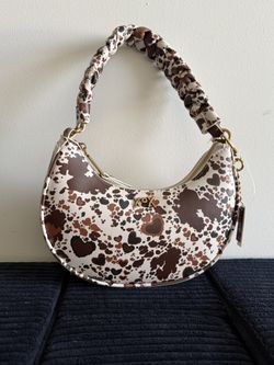 Betsey Johnson’s XOX Crescent Shoulder Bag