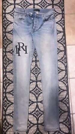 Amiri Staggered Logo Jeans