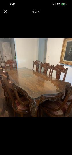 Ornate wood dining table and 8 chair set