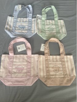 Brand new with tags Trader Joe’s pastel canvas mini tote bags ($15 each) or ($ 50 for bundle of four each color)