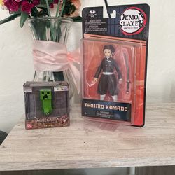 Unopened Demon slayer figurine & minecraft creeper figurine 
