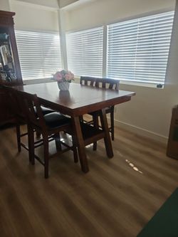 Tall table dark wood 4 chairs with bench