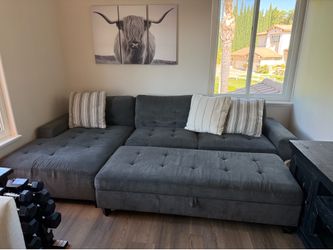 Gray sectional couch with ottoman