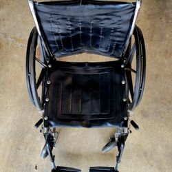 Wheelchair With Arm And Foot Rests