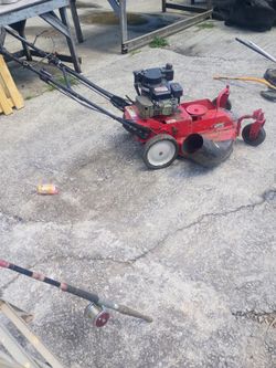$350.00 A Running Snapper 26 ins walk behind mower