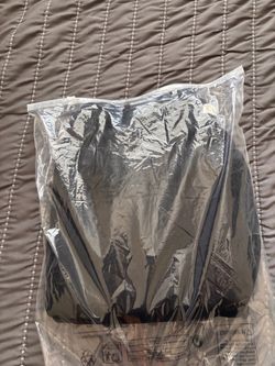 Dark Clothing Item in Sealed Plastic Bag
