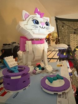 LEGO Disney stitch and aristocat Marie and a 3. In one build