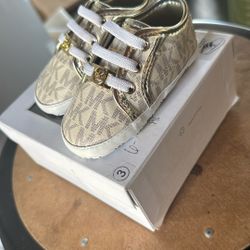3c (6-9 Mths) Michael Kors Gold and White Baby Sneakers with Signature MK Design