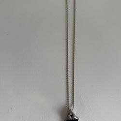 Chrome Hearts Necklace with pendant with the  Rolling Stones tongue & lips logo. Plated silver.