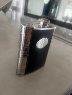 8oz black Flask leather & silver faux  … $25 (Has faint monogrammed letters on it)