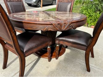 Elegant round marble-style dining table set with 4 chairs- carved wood detail