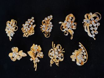 $15. NINE brooches for $15 total! Gold-plated with glass rhinestones. All nine are different. They are not antique or vintage but they look it.