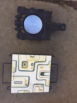 Two vintage trivets with plugs