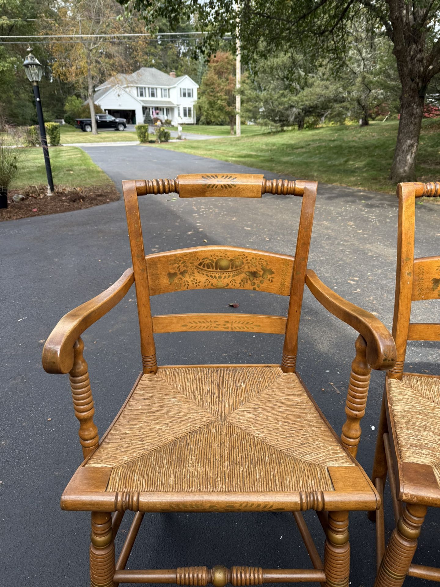 6 Hitchcock style chairs with woven rush seat and stenciled backs.
