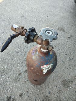 Small helium tank approximately 20 in tall
