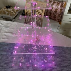 Acrylic cake stand with string neon pink lights