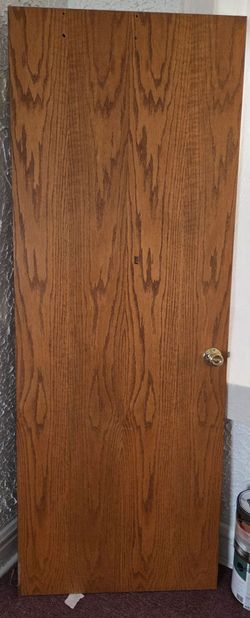 Interior Wood Grain Door with Brass Knob