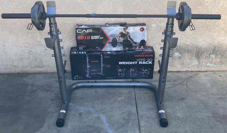 Weights XRS 20 Squat Rack With 110lb Olympic Set Comes With a 3 Piece 7ft Olympic Bar 2x25s,2x10s and 2x5s (built or in Box)