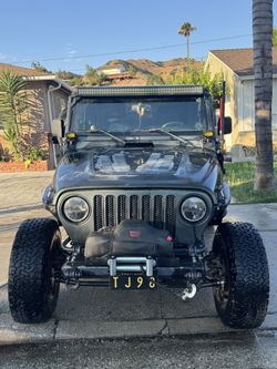 1998 Jeep Tj Wrangler 4.0 6 cyl Has a lot of upgrades 184,xxx original miles 33 inch wheels Method wheels Rough country long arm kit Rear tire carrie