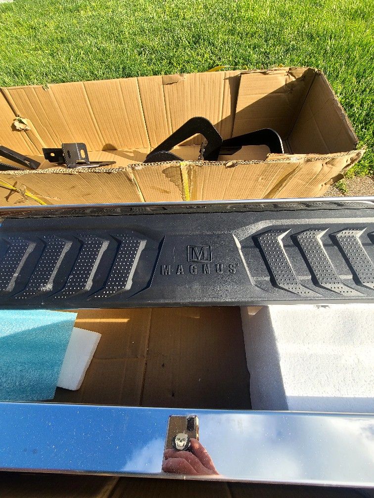 Step rail for a truck.