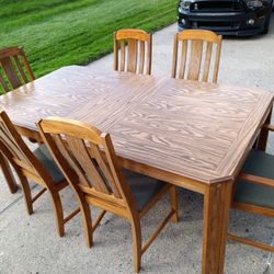  Solid wood Dining table and 6 chairs, 2 leaves and matching china cabinet. Solid wood-Can deliver for fee-TBD