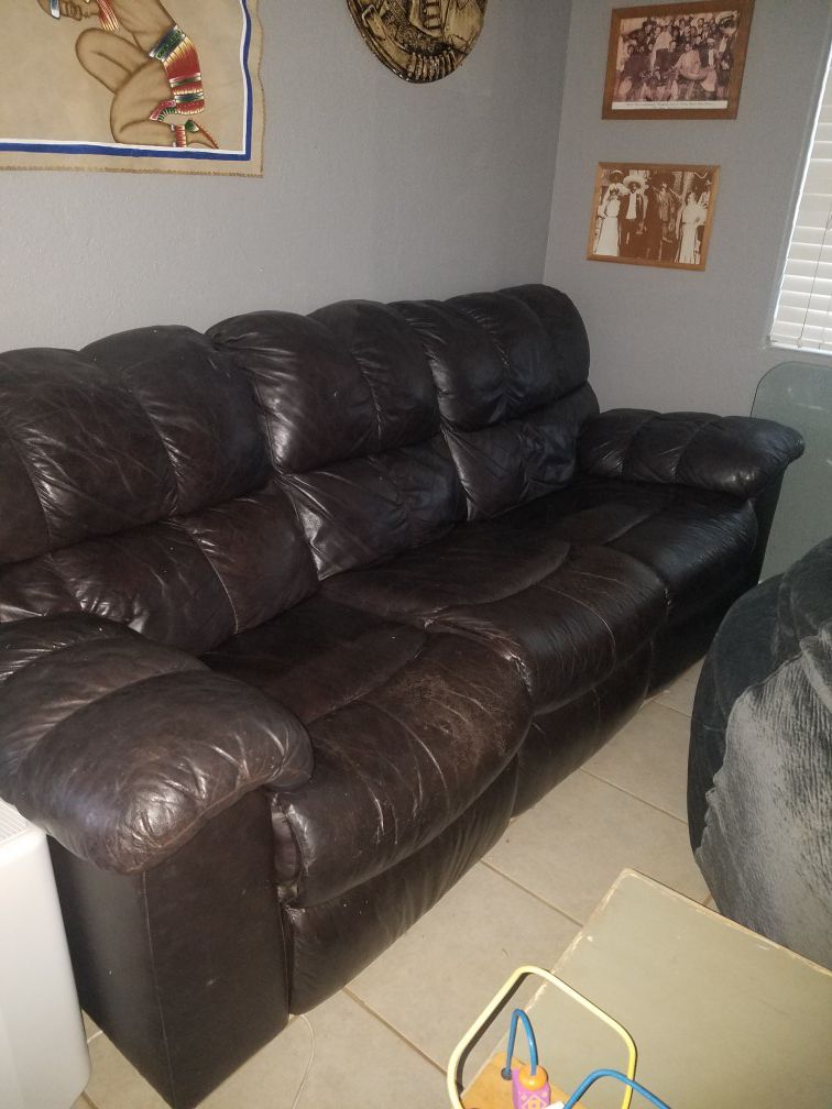 Real leather sofa has reclining on both ends