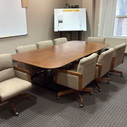 Solid oak office desk with eight chairs must be picked up today. Free if you can pick it up today.