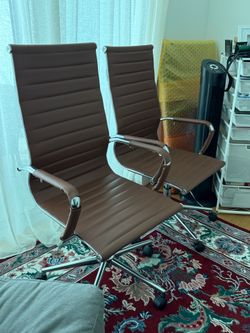 brown PU leather ribbed high-back office chairs with chrome frames.