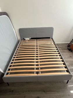 Gray Upholstered Bed Frame with Slatted Base