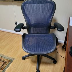 Herman Miller Aeron Size C Chair Fully Loaded With Adjustable Arm With Dark Blue Mesh.