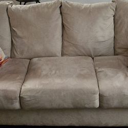 Sleeper Beige Sofa with Decorative Pillows