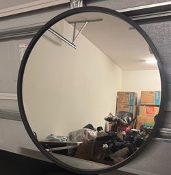 Black round mirror.