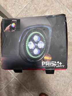 Kuryakyn Orbit Prism+ 7-inch LED Motorcycle Headlight (Model 2478) with a Bluetooth-controlled, multicolor halo ring.